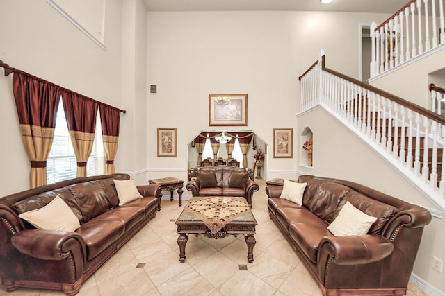 20718 Mansfield Bay Ln, Richmond, TX 77407 - living room featuring a high ceiling and stairway