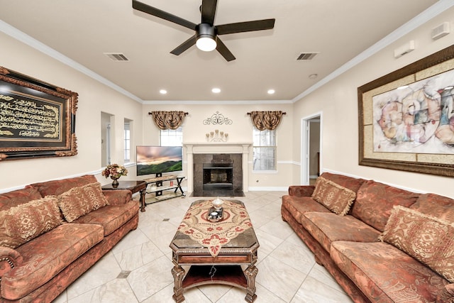 20718 Mansfield Bay Ln, Richmond, TX 77407 - living room featuring a ceiling fan, ornamental molding, a tile fireplace, light tile patterned floors, and recessed lighting