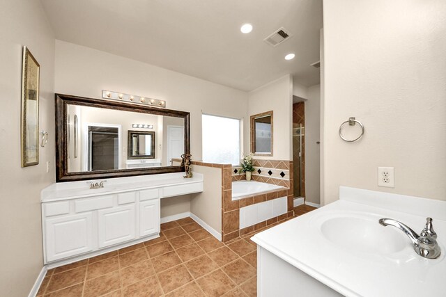 20718 Mansfield Bay Ln, Richmond, TX 77407 - bathroom with vanity, a garden tub, tile patterned flooring, a shower stall, and recessed lighting