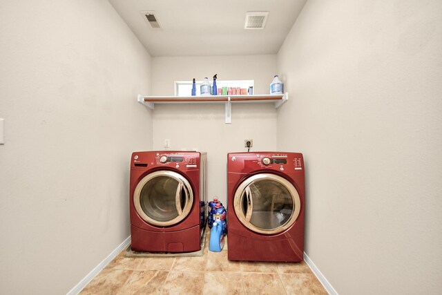 20718 Mansfield Bay Ln, Richmond, TX 77407 - laundry room featuring washing machine and clothes dryer and tile patterned flooring