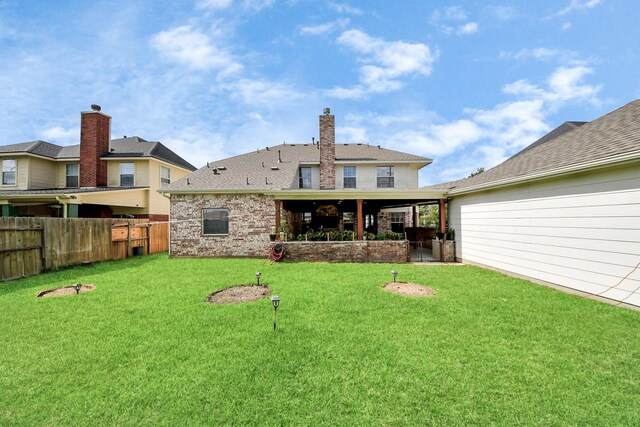 20718 Mansfield Bay Ln, Richmond, TX 77407 - back of house with brick siding and a shingled roof