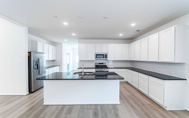 25035 Apricot Ct, Montgomery, TX 77316 - kitchen featuring stainless steel appliances, light wood-style floors, decorative backsplash, and recessed lighting