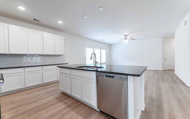 25035 Apricot Ct, Montgomery, TX 77316 - kitchen featuring dishwasher, light wood-style floors, backsplash, ceiling fan, and recessed lighting