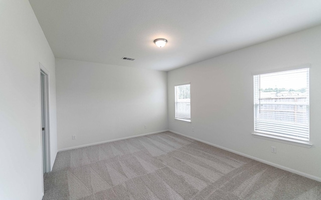 25035 Apricot Ct, Montgomery, TX 77316 - unfurnished room with light colored carpet and baseboards