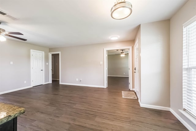 10327 Collingswood Rd, La Porte, TX 77571 - unfurnished living room featuring a ceiling fan and dark wood-type flooring
