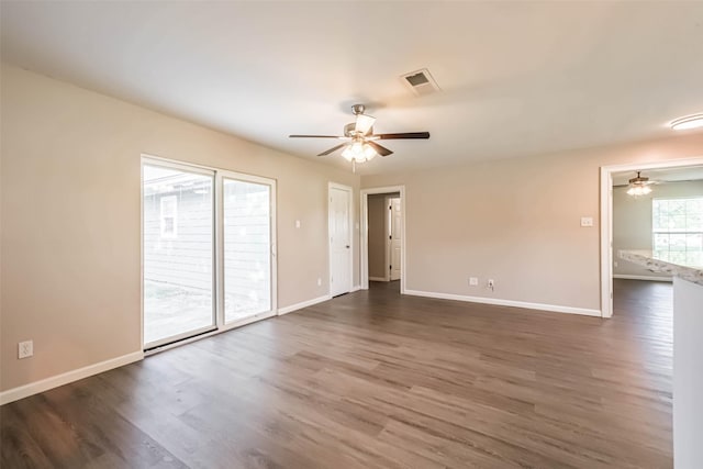 10327 Collingswood Rd, La Porte, TX 77571 - spare room featuring ceiling fan and dark wood-style floors