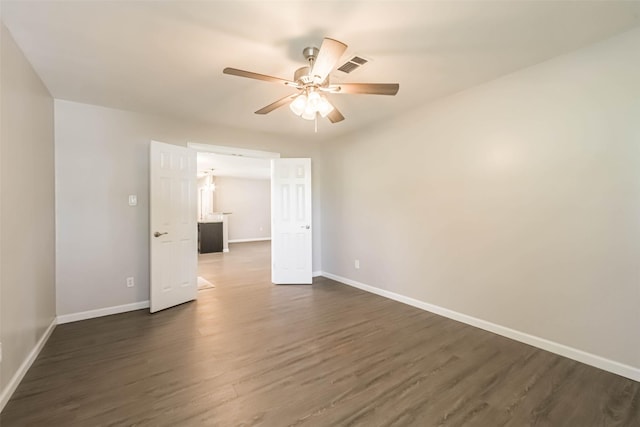 10327 Collingswood Rd, La Porte, TX 77571 - unfurnished room featuring dark wood-type flooring and ceiling fan