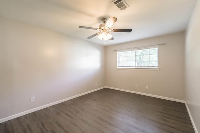 10327 Collingswood Rd, La Porte, TX 77571 - spare room with dark wood-style floors and a ceiling fan
