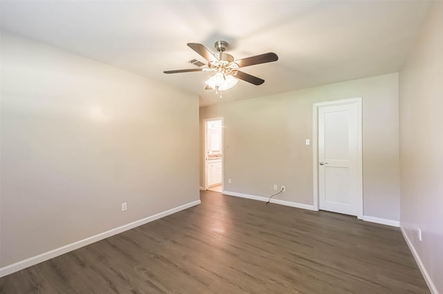 10327 Collingswood Rd, La Porte, TX 77571 - spare room with a ceiling fan and dark wood-type flooring