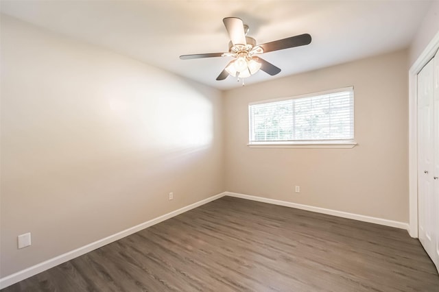 10327 Collingswood Rd, La Porte, TX 77571 - unfurnished bedroom featuring dark wood-style floors, a closet, and a ceiling fan