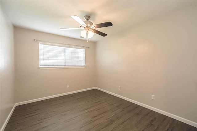 10327 Collingswood Rd, La Porte, TX 77571 - spare room featuring dark wood-type flooring and a ceiling fan