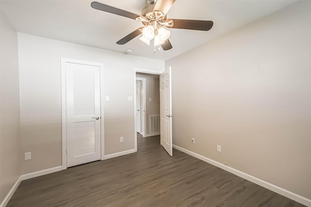 10327 Collingswood Rd, La Porte, TX 77571 - unfurnished bedroom with dark wood-type flooring and a ceiling fan