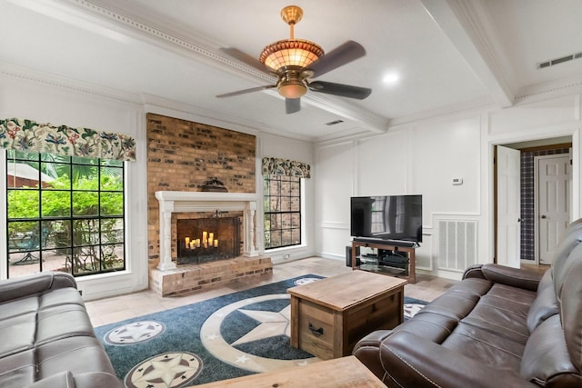 5 Hartwick Ct, Conroe, TX 77304 - living room featuring a decorative wall, a ceiling fan, beamed ceiling, healthy amount of natural light, and a brick fireplace