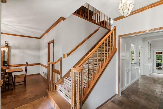 5 Hartwick Ct, Conroe, TX 77304 - stairs with crown molding and baseboards