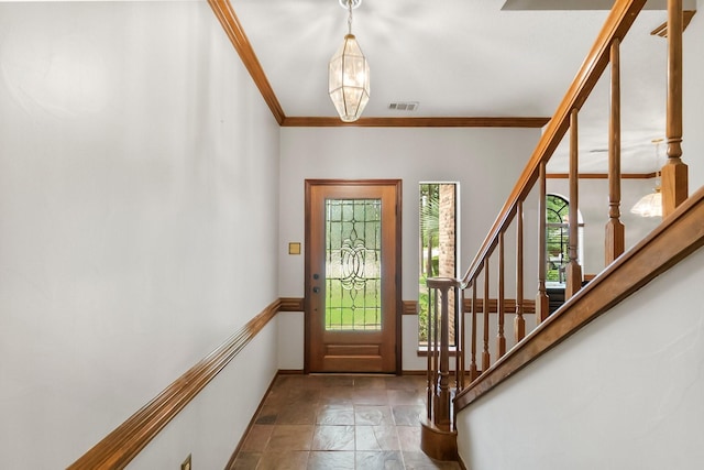5 Hartwick Ct, Conroe, TX 77304 - entrance foyer with stairs, stone finish flooring, and crown molding