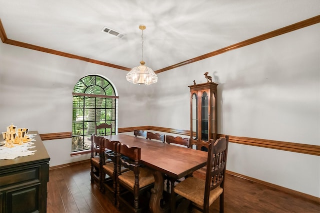 5 Hartwick Ct, Conroe, TX 77304 - dining space with ornamental molding, dark wood finished floors, and a chandelier