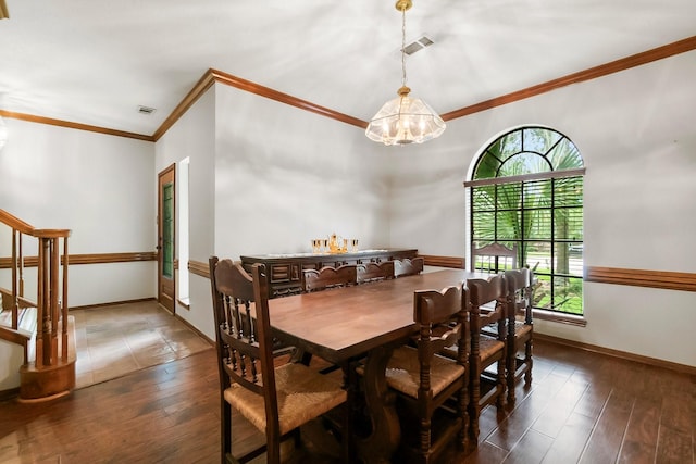5 Hartwick Ct, Conroe, TX 77304 - dining room with plenty of natural light, crown molding, hardwood / wood-style flooring, a chandelier, and stairway