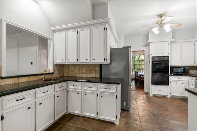 5 Hartwick Ct, Conroe, TX 77304 - kitchen featuring black appliances, dark countertops, white cabinets, tasteful backsplash, and vaulted ceiling