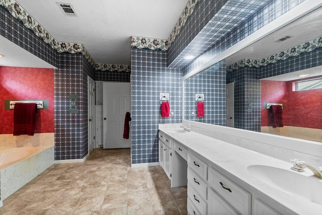 5 Hartwick Ct, Conroe, TX 77304 - bathroom with wallpapered walls, double vanity, and a garden tub