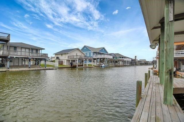 23002 Lunes St, Galveston, TX 77554 - dock featuring a water view and a residential view