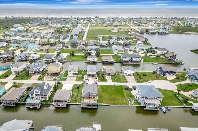 23002 Lunes St, Galveston, TX 77554 - aerial view of property and surrounding area with nearby suburban area and a large body of water