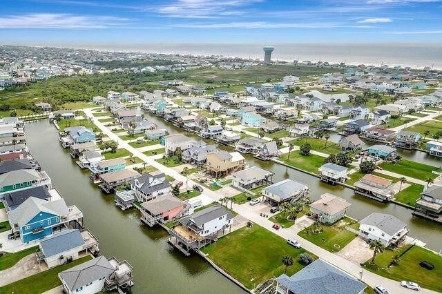23002 Lunes St, Galveston, TX 77554 - aerial perspective of suburban area featuring a nearby body of water