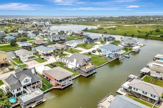23002 Lunes St, Galveston, TX 77554 - aerial perspective of suburban area featuring a nearby body of water