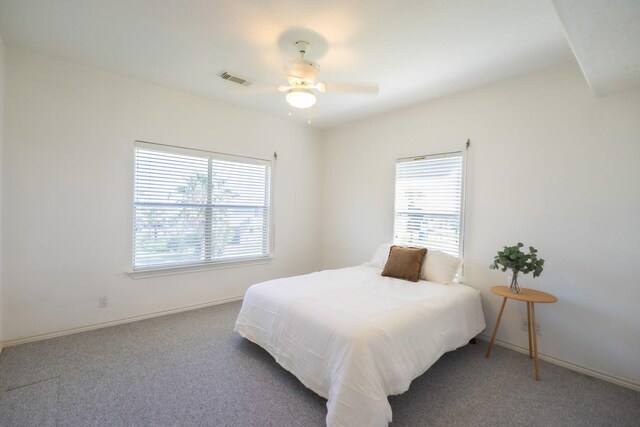 23002 Lunes St, Galveston, TX 77554 - carpeted bedroom with baseboards and a ceiling fan
