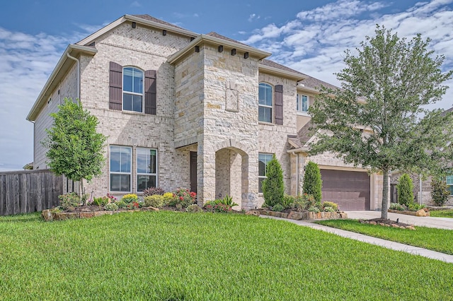 2008 Bristol Cliff Ln, Pearland, TX 77089 - french country inspired facade featuring brick siding, a garage, and driveway
