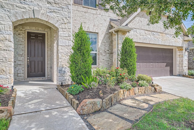 2008 Bristol Cliff Ln, Pearland, TX 77089 - entrance to property featuring stone siding, concrete driveway, and brick siding