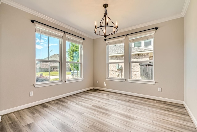 2008 Bristol Cliff Ln, Pearland, TX 77089 - spare room featuring a chandelier, light wood finished floors, and crown molding