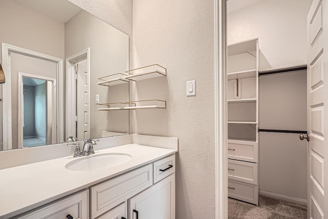 2008 Bristol Cliff Ln, Pearland, TX 77089 - bathroom with vanity and a textured wall
