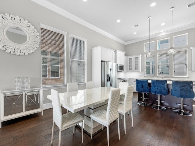 9662 Knight Rd, Houston, TX 77045 - dining space featuring ornamental molding, dark wood-type flooring, and recessed lighting