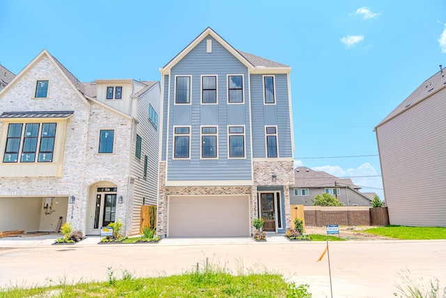 1716 Sedola Ln, Houston, TX 77055 - view of property featuring driveway, an attached garage, and stone siding