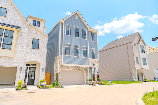 1716 Sedola Ln, Houston, TX 77055 - view of front facade with concrete driveway, an attached garage, and brick siding