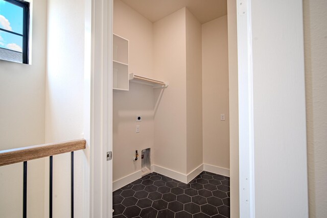 1716 Sedola Ln, Houston, TX 77055 - washroom featuring electric dryer hookup and dark tile patterned flooring