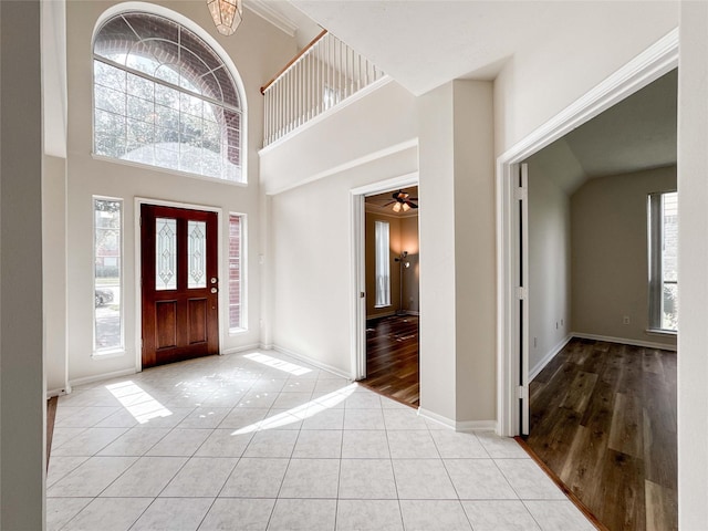 3106 Alexandros Ct, Pearland, TX 77584 - entrance foyer featuring tile patterned floors, a towering ceiling, and a ceiling fan