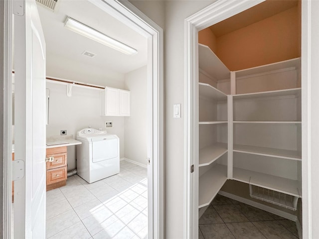 3106 Alexandros Ct, Pearland, TX 77584 - laundry area featuring washer / clothes dryer, cabinet space, and light tile patterned floors