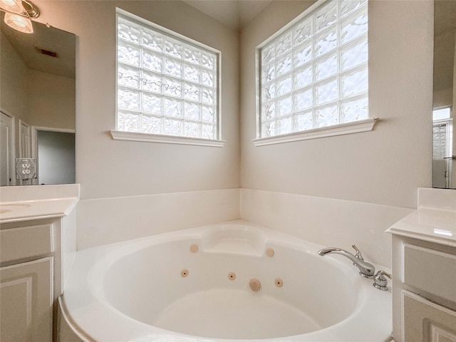 3106 Alexandros Ct, Pearland, TX 77584 - full bathroom featuring vanity, plenty of natural light, and a jetted tub