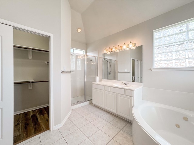 3106 Alexandros Ct, Pearland, TX 77584 - full bath featuring a stall shower, vaulted ceiling, vanity, a tub with jets, and a walk in closet
