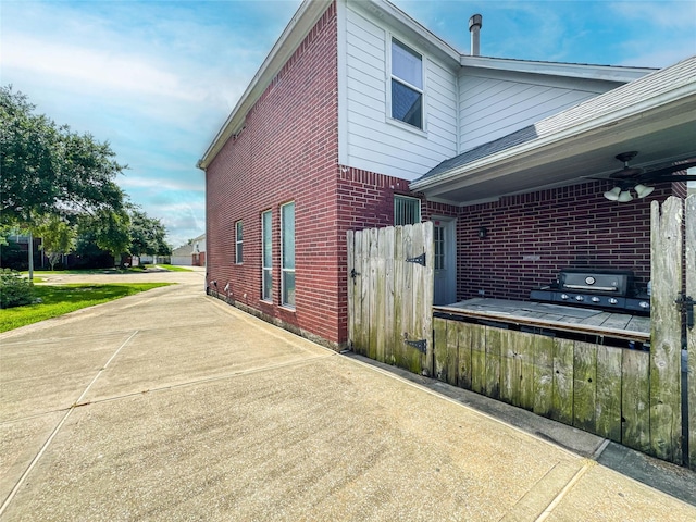 3106 Alexandros Ct, Pearland, TX 77584 - view of property exterior featuring brick siding and a ceiling fan