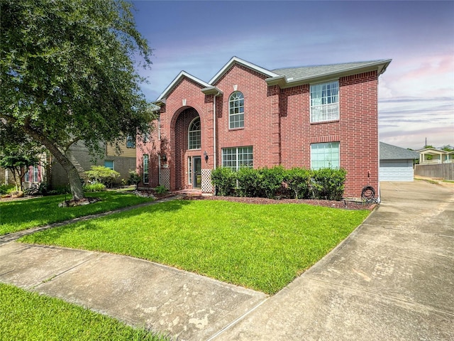 3106 Alexandros Ct, Pearland, TX 77584 - traditional-style home with a front lawn, brick siding, and a detached garage