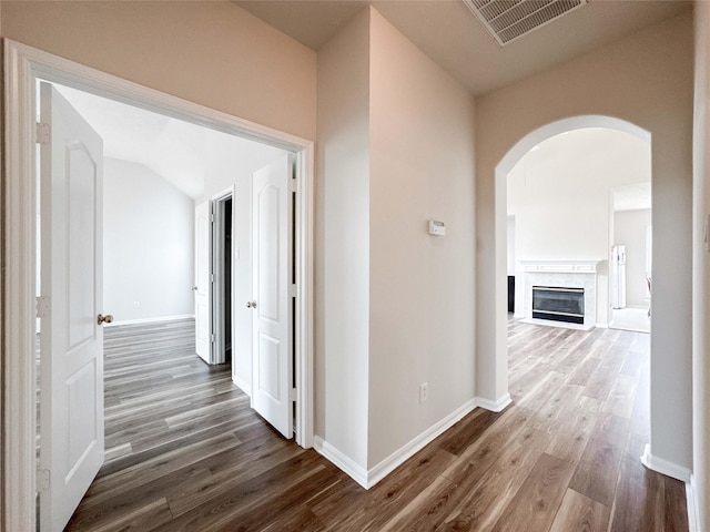 3106 Alexandros Ct, Pearland, TX 77584 - corridor featuring dark wood-style flooring and arched walkways