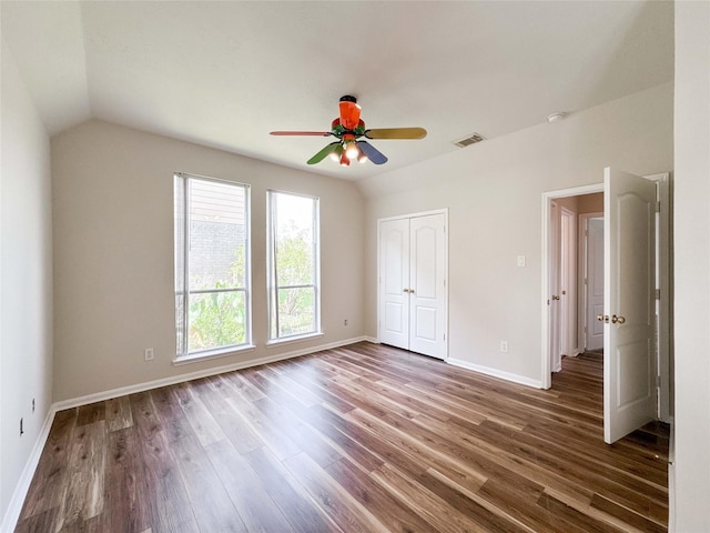 3106 Alexandros Ct, Pearland, TX 77584 - unfurnished bedroom featuring wood finished floors, vaulted ceiling, a closet, and a ceiling fan