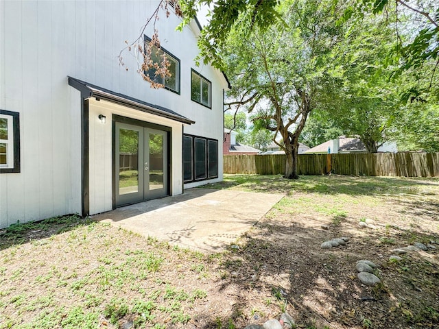 10610 Mills Prairie St, Houston, TX 77070 - fenced backyard with french doors and a patio area