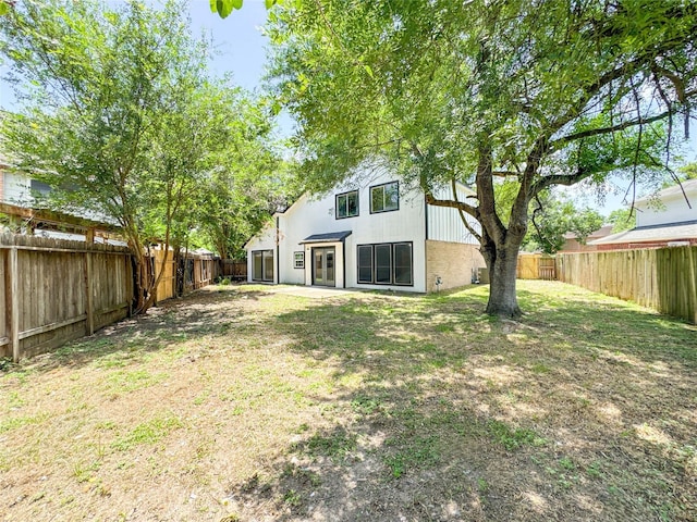 10610 Mills Prairie St, Houston, TX 77070 - rear view of house with a fenced backyard