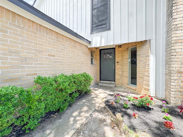 10610 Mills Prairie St, Houston, TX 77070 - view of exterior entry featuring board and batten siding and brick siding
