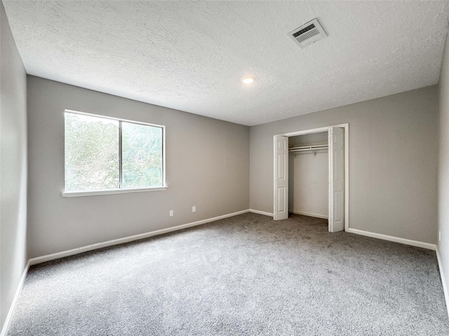 10610 Mills Prairie St, Houston, TX 77070 - unfurnished bedroom with carpet floors, a textured ceiling, a closet, and recessed lighting