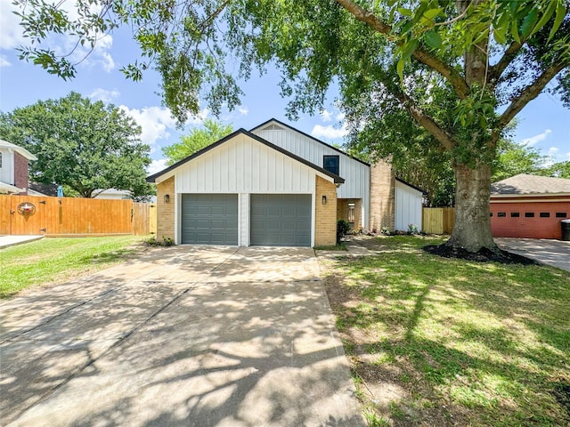 10610 Mills Prairie St, Houston, TX 77070 - mid-century home with brick siding, concrete driveway, a garage, and board and batten siding