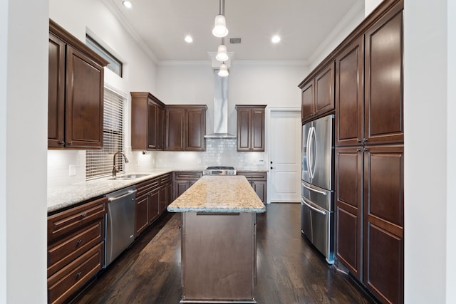 4611 Rose St, Houston, TX 77007 - kitchen with appliances with stainless steel finishes, crown molding, dark brown cabinets, light stone counters, and a kitchen island